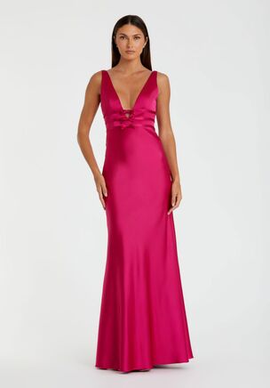 This sleek satin gown features a sleeveless design with a flattering V-neckline, complemented by elegant front and back bow detailing, making it a chic and sophisticated choice for any formal event.