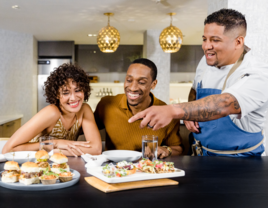 Couple taste testing catered food