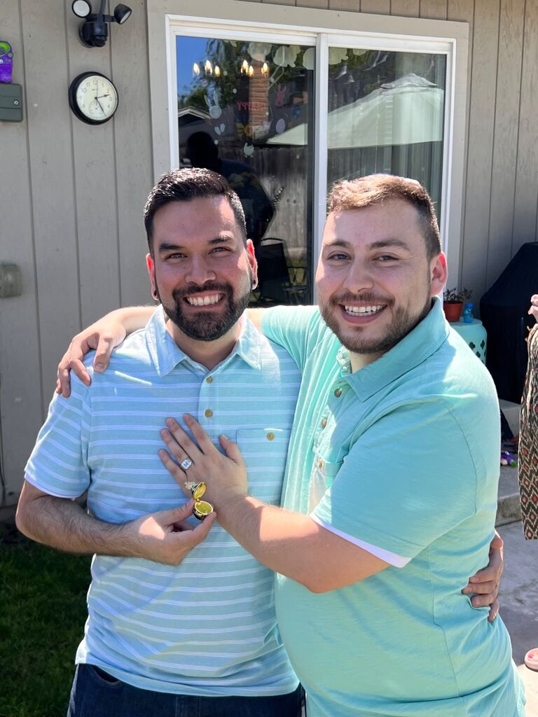 HE SAID YES: Daniel pulled off the unthinkable: he actually surprised Christian with an Easter proposal! In the middle of a festive round of Pin-the-Tail-on-the-Bunny (yes, really), Christian was blindfolded and spinning in circles, totally unaware of what was coming. When the blindfold came off, there was Daniel, down on one knee with a ring.