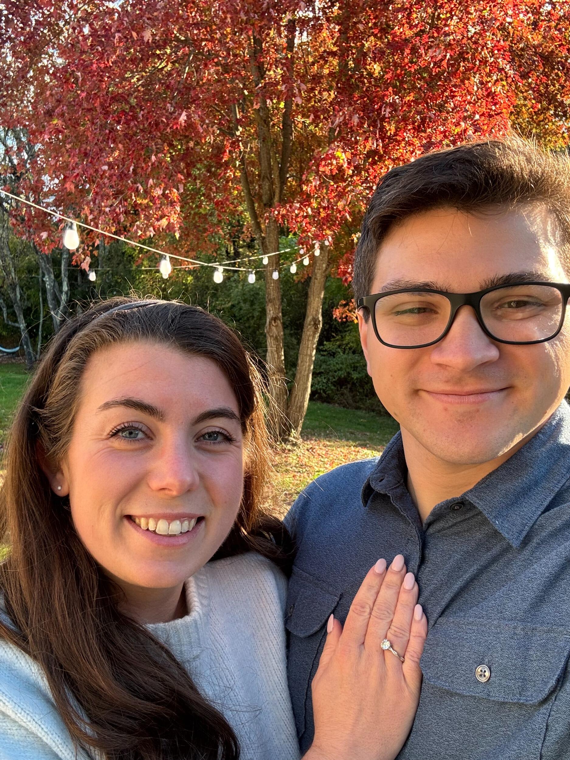 While seemingly going to take George for a walk on a beautiful autumn day, Nick had other plans in mind and surprised Megan with a perfect proposal in the gardens at Vanderbilt Mansion, one of their favorite places.  
