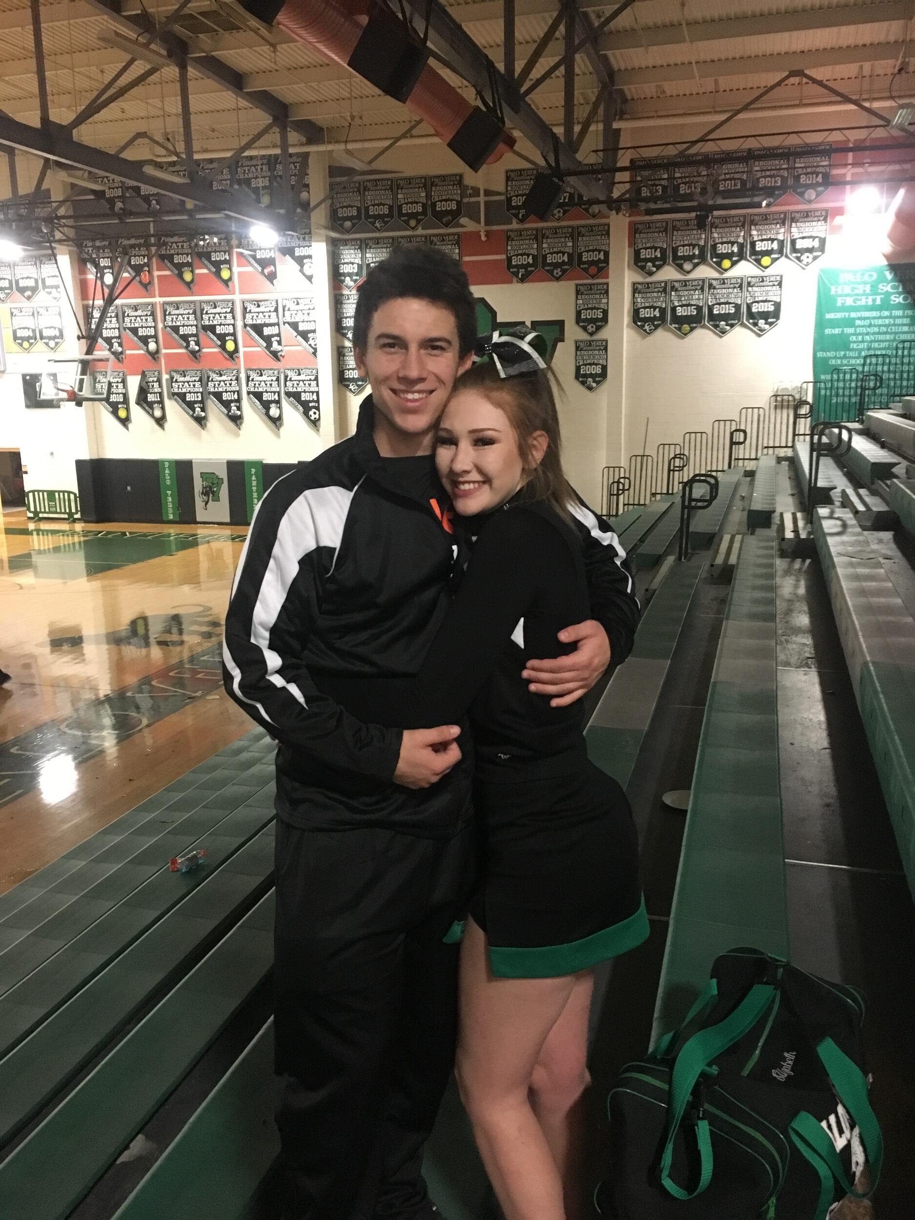 Elizabeth cheered at Logan's basketball game