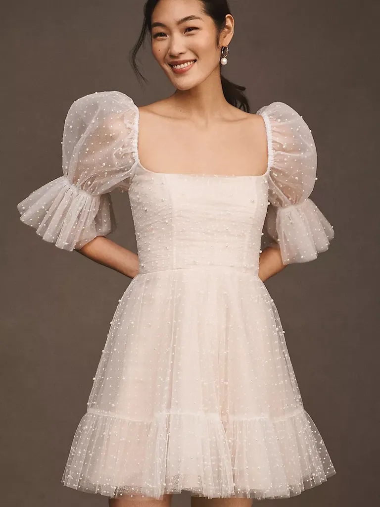 Bride in pearl mini dress