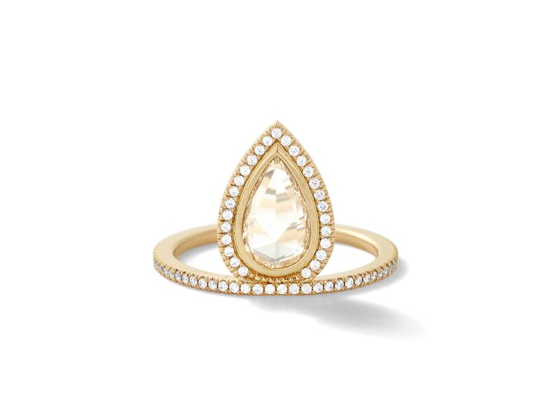pear shaped rose cut diamond in diamond halo setting in yellow gold