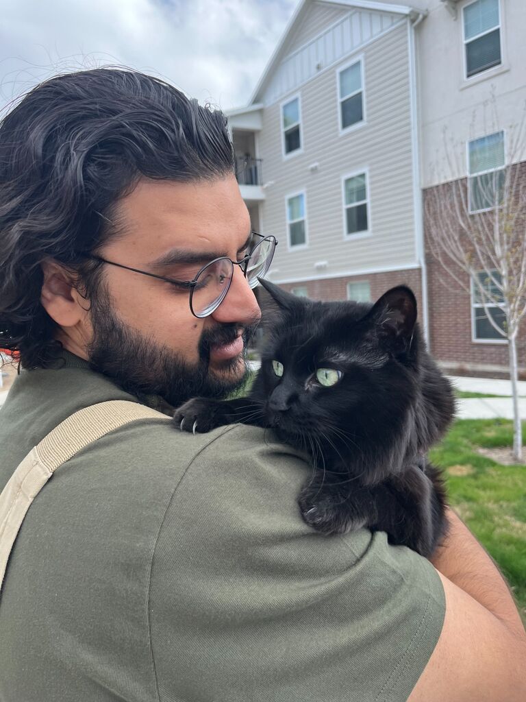 Raminder and his adopted fur child, Nova.