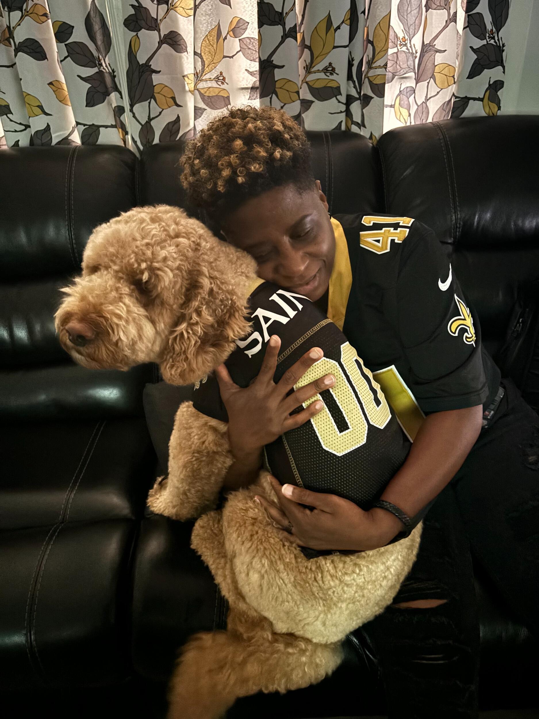 Woot-Woot!! Saints beat the Falcons 20 to 17....Basil doesn't care...still not too sure about this person who keeps visiting, hugging, and dressing him in matching shirts! Nope, don't like it!!