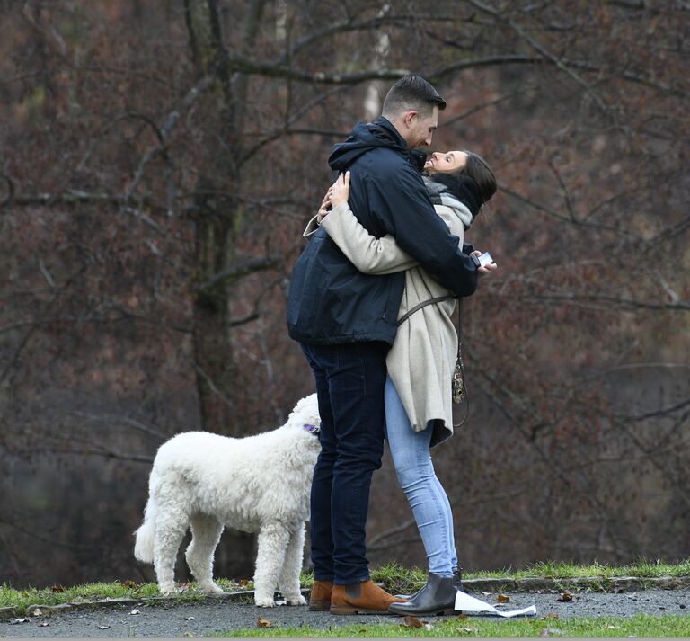 Jenny and Martin took the family dog, Callie, on a walk to the nearby lake in Berlin, where Jenny grew up. Martin got down on one knee at the lake with both of the families hiding in the bushes. Jenny and Martin had been dating long distance for 1.5 years and spent less than 50 days together. 