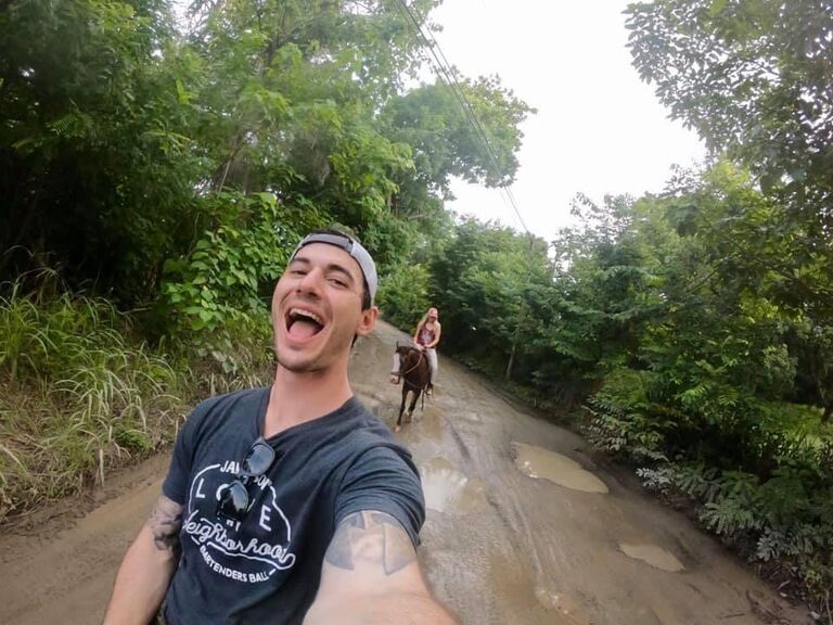 Taking a tour on horseback through the jungle.