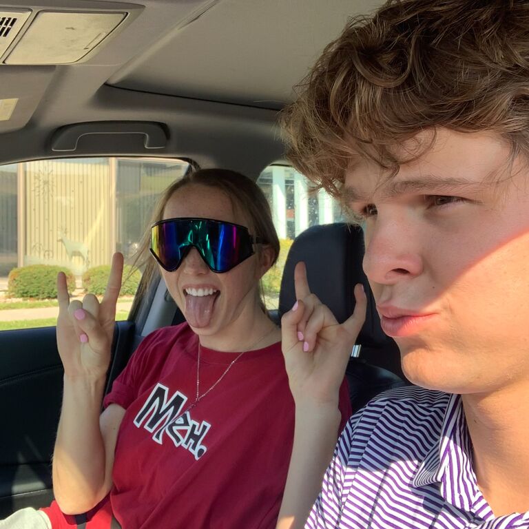 Hope flexing how great she looks in Nathan's baseball sunglasses.