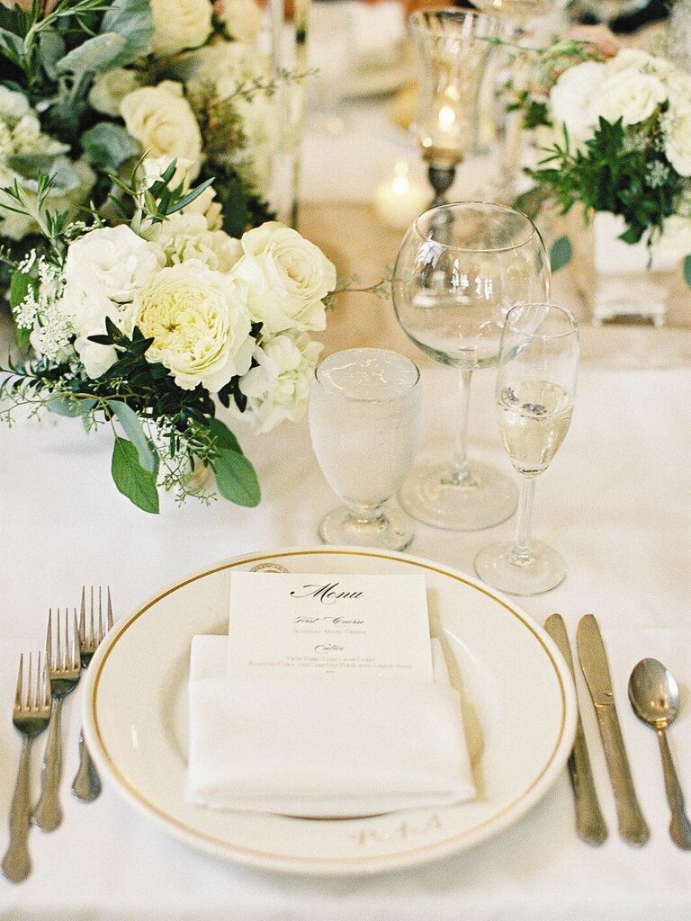 White rose and cream vintage-inspired wedding reception decor