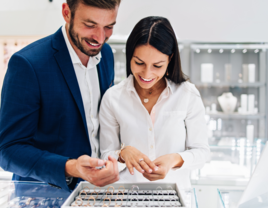 Man and woman shopping for engagement ring