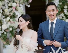 Bride giving speech during wedding reception.