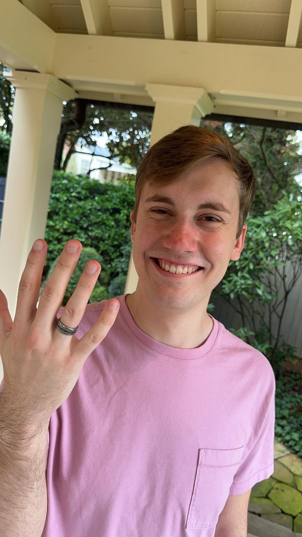 Ethan with the ring on the wrong hand after the proposal. 