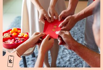 Couple giving a red envelope gift
