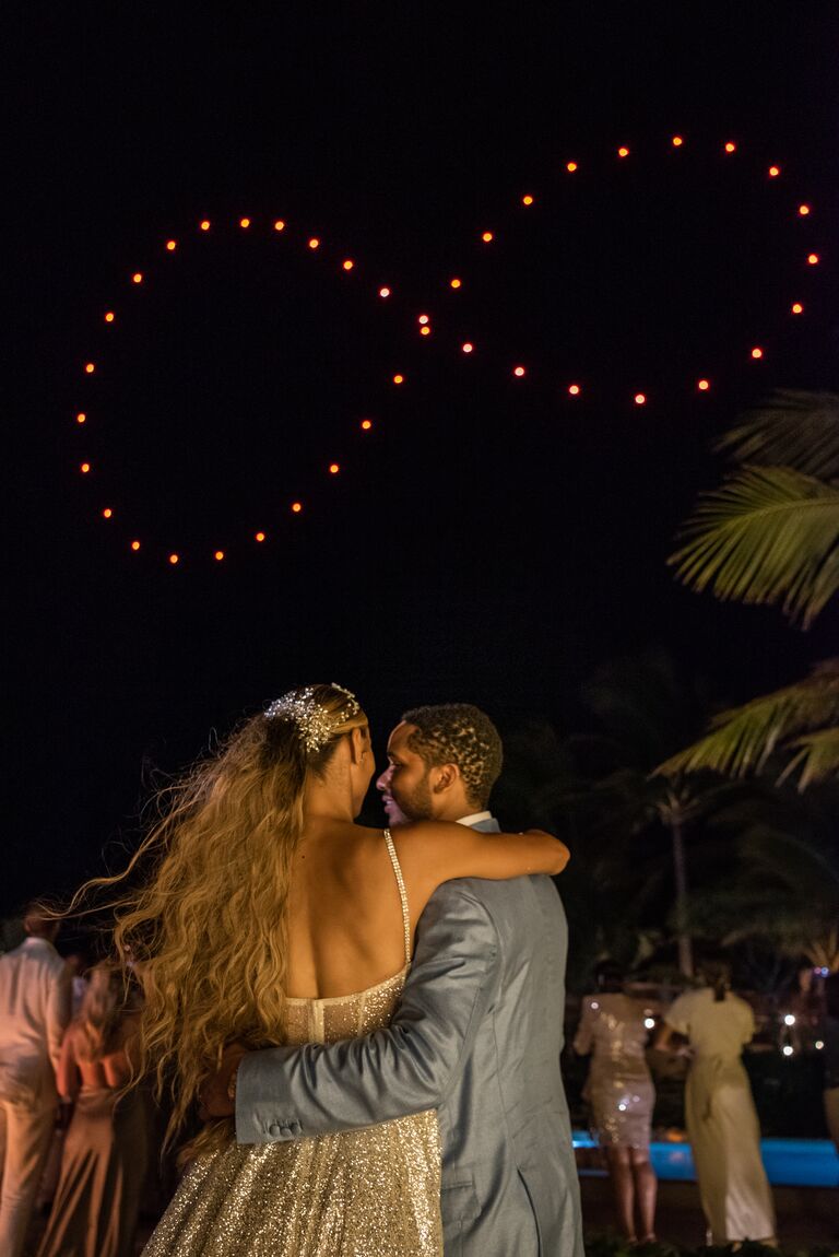 ally love wedding fireworks infinity sign over the couple