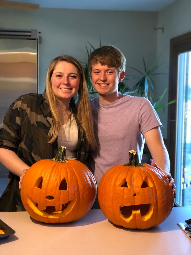 First time carving pumpkins. Aaron did the best he could ๐