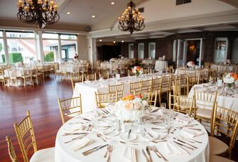 Large elegant event space with hanging ornate chandeliers