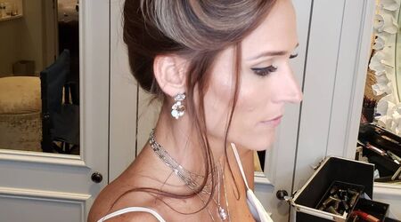 Premium Photo  Close-up of the bride's hairstyle. curls. jewelry with pearls  for hair. wedding ceremony. preparatio