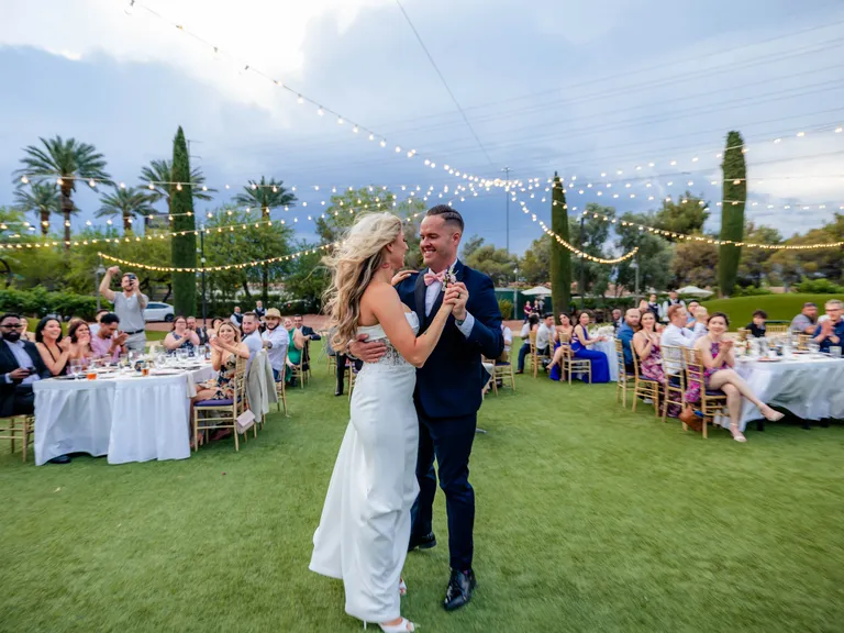 Bride and groom sharing first dance out outdoor venue with lessons by Embodied Movement in St Petersburg, Florida