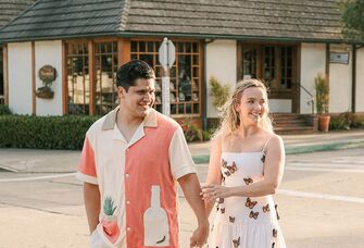 Engagement photo of couple holding hands