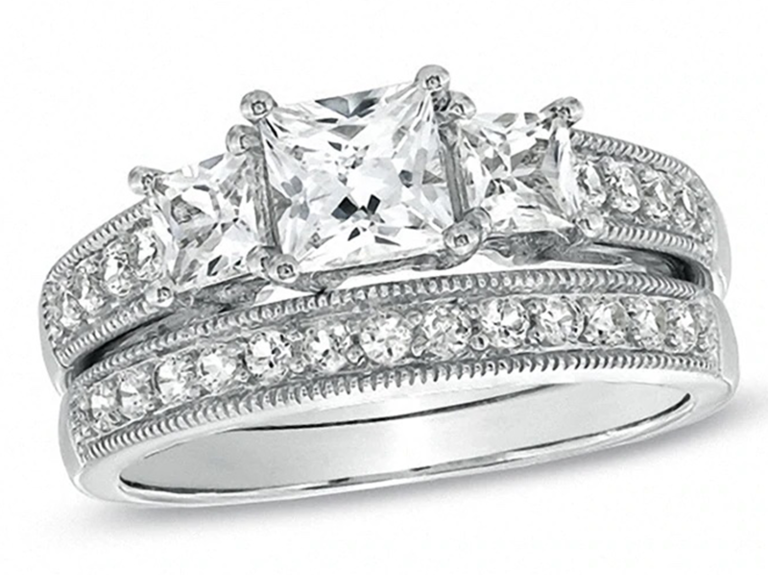 Three princess diamonds on thick pave diamond silver band with matching wedding band
