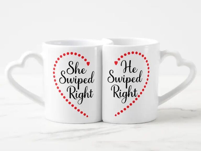 'She swiped right' and 'He swiped right' in black script with half of red heart on white mug