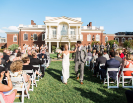 Couple walking down aisle holding hands at The Philadelphia Cricket Club wedding venue