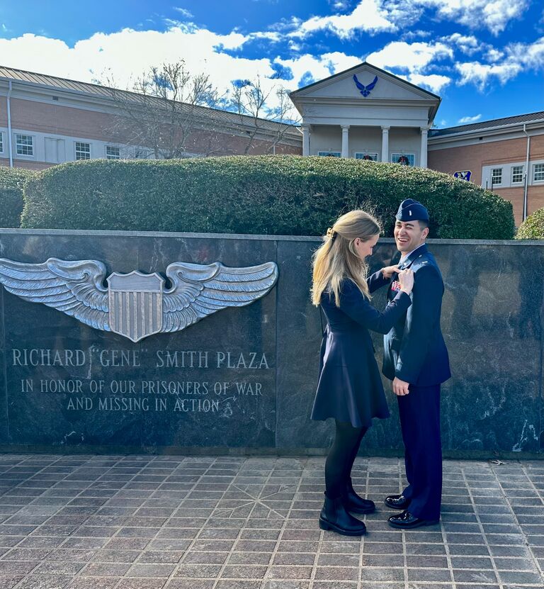 Olivia's turn to pin Mike with some silver wings. 