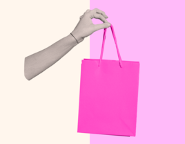 Hand holding shopping bag