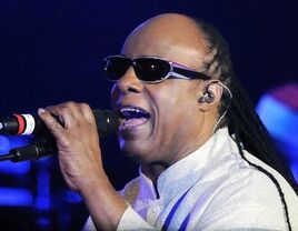 Stevie Wonder singing at his concert.