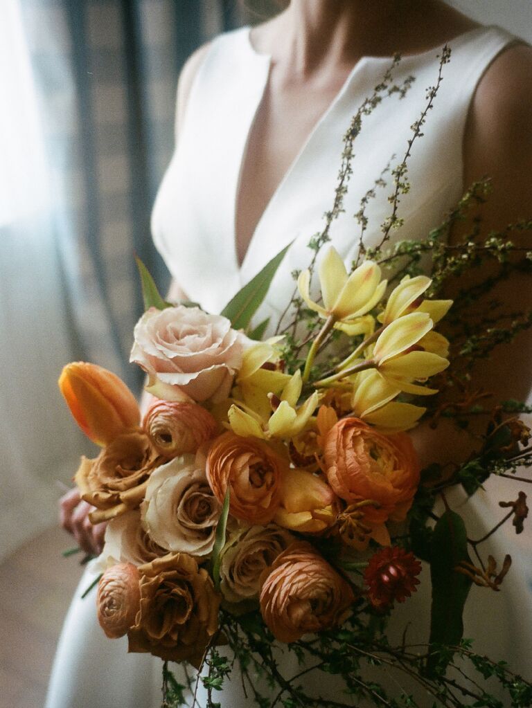 Film wedding photography of bride holding bouquet of flowers