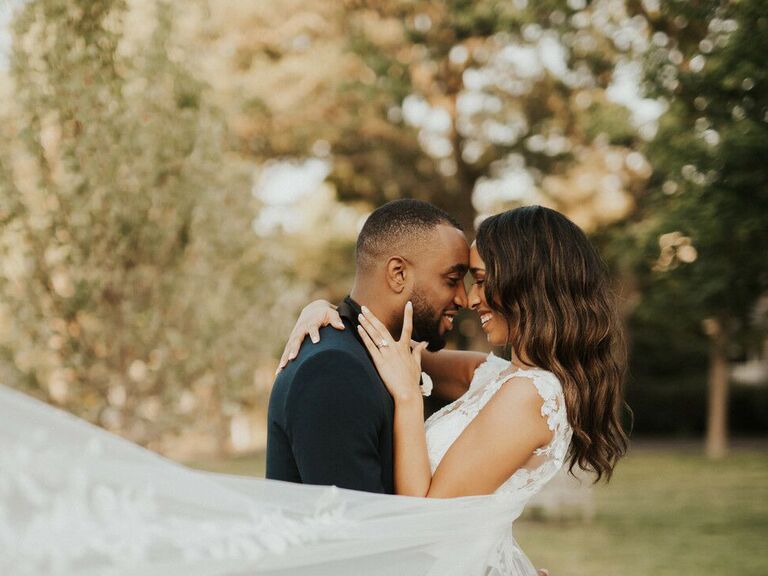 friluftsliv wedding couple hugging and smiling in front of trees