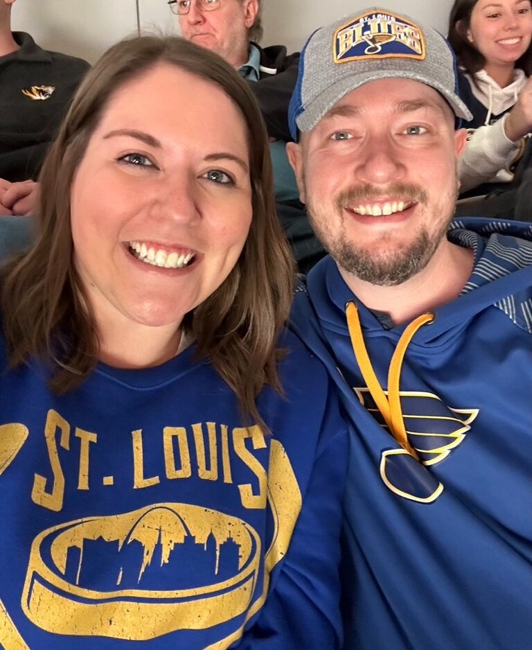 Our first photo together - Blues game for our 5th date! 