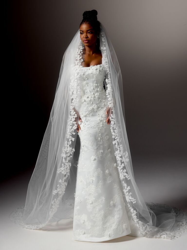 Fitted column wedding dress with 3D floral appliques and lace-lined veil by Justin Alexander