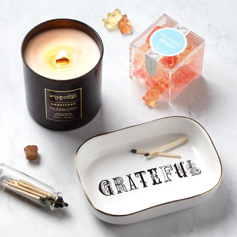 Thank-you gift set featuring gummy bears, a candle, and a jewelry dish