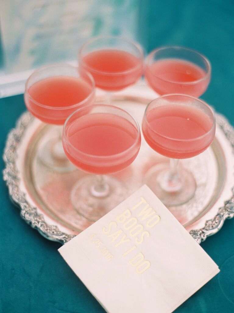 A gorgeous antique silver tray offers guests a glass of coral-pink punch.