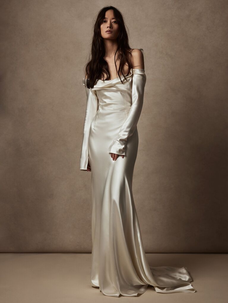 danielle frankel pearl colored silk and wool off the shoulder wedding slip dress with long sleeves and flowy skirt