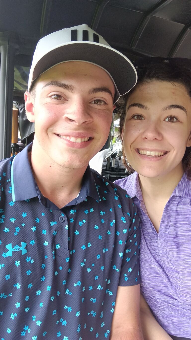 The two of us hanging out in the golf cart while out on the course. 