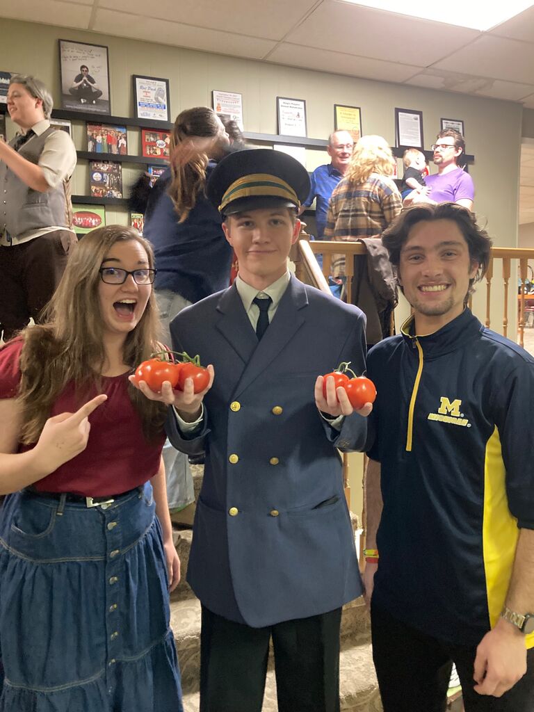 This is the first official photo of us...with our friend Matthew (one of the groomsmen) who happened to have been positioned between us in handbells, which is where we met. Colin was in a play, and Matt and I brought him tomatoes!