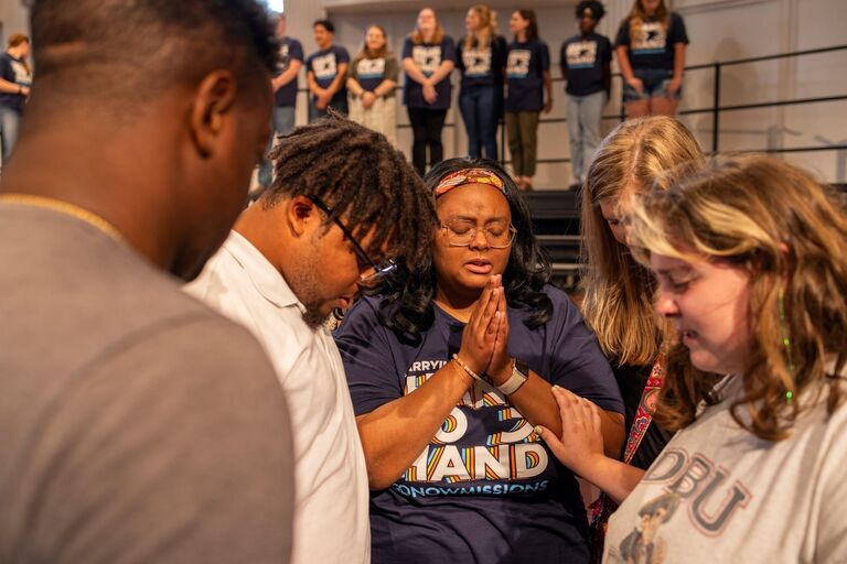 At Jo's Commissioning service for a mission trip to Eastern Europe, Joshua joined their friends to pray over her: commissioning her to be sent out, the very next day, to spread the gospel in 7 countries. 