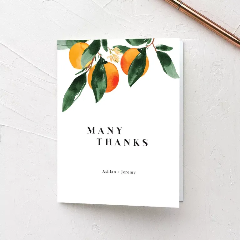The Knot wedding thank you card with orange fruit imagery and many thanks wording