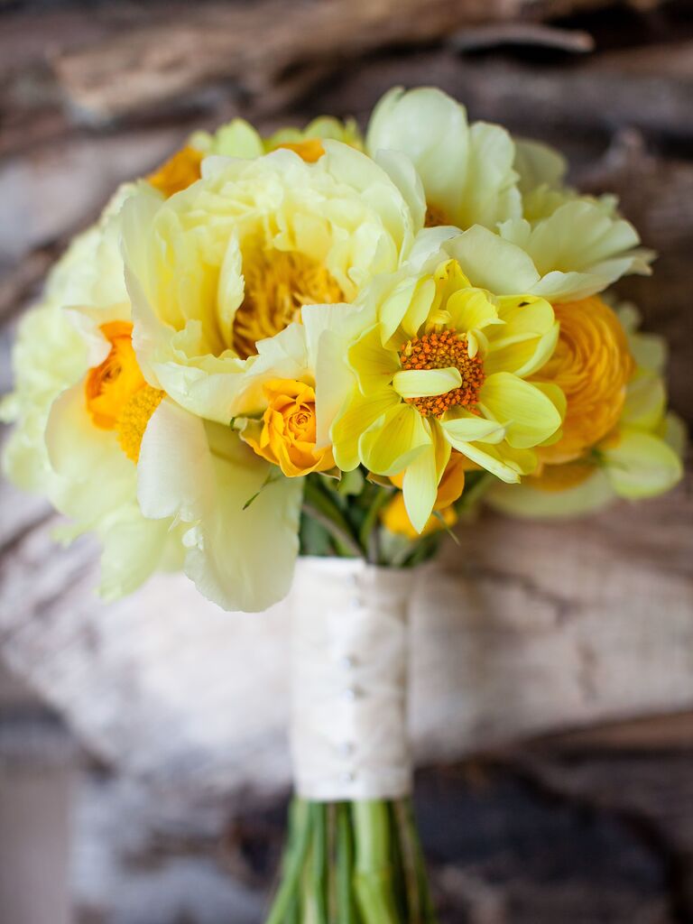 A vibrant yellow bouquet, bursting with peonies.