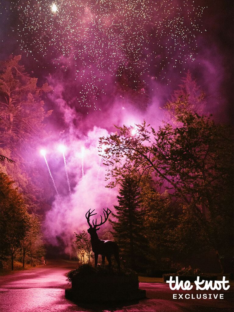 Fireworks exploding over Logan Rae Hill's wedding venue