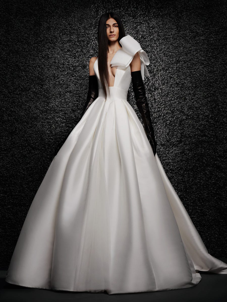 A-line ball gown with plunging neckline and oversized bow on sleeve