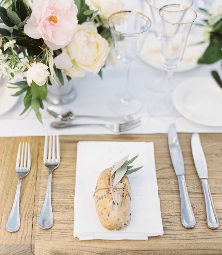 Sage and bread place setting with spring of herbs