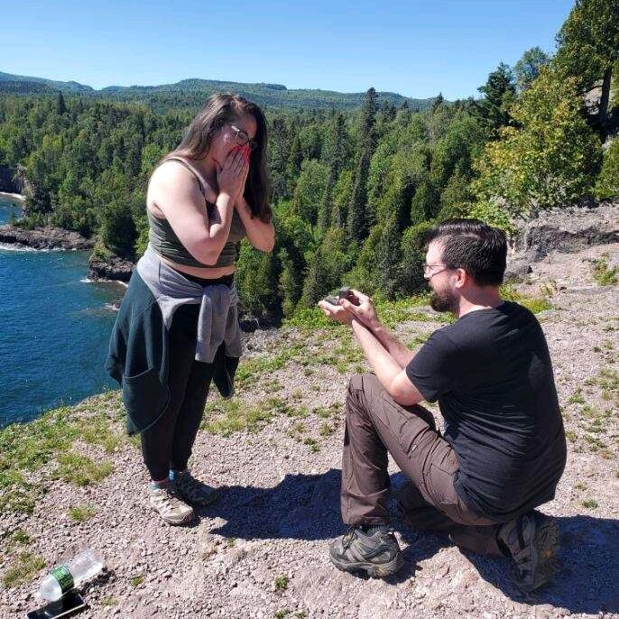 Chad proposed at one of the most breathtaking spots we’ve ever visited—Shove Point Trail in Tettegouche State Park, overlooking the vast beauty of Lake Superior. It was during a Labor Day camping trip with friends, and after a scenic hike, he got down on one knee, turning an already unforgettable day into the best moment of our lives.