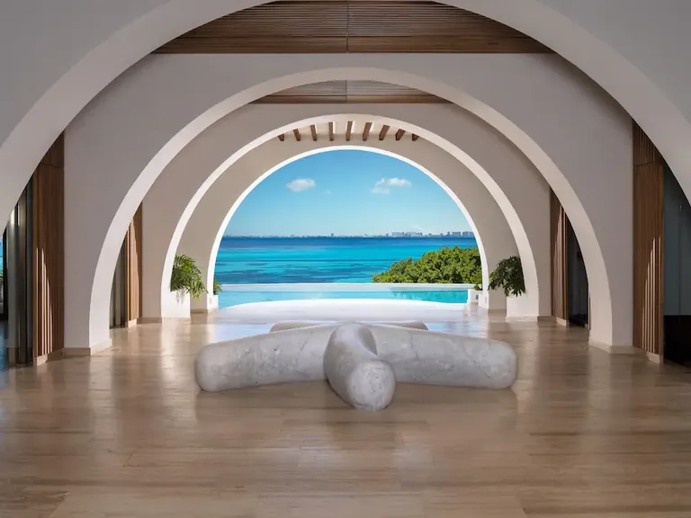 Interior lobby arches with beach view at Impression Isla Mujeres by Secrets all-inclusive resort in Mexico
