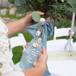 bride holding bouquet in custom wrap with message from mom