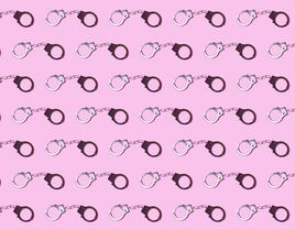 Pattern of metal locked handcuffs on a pink background.