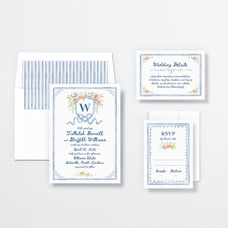 White and blue wedding invitations with floral accents