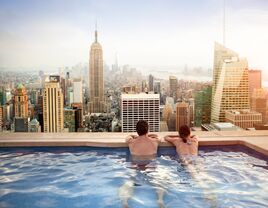 Couple relaxing on hotel rooftop